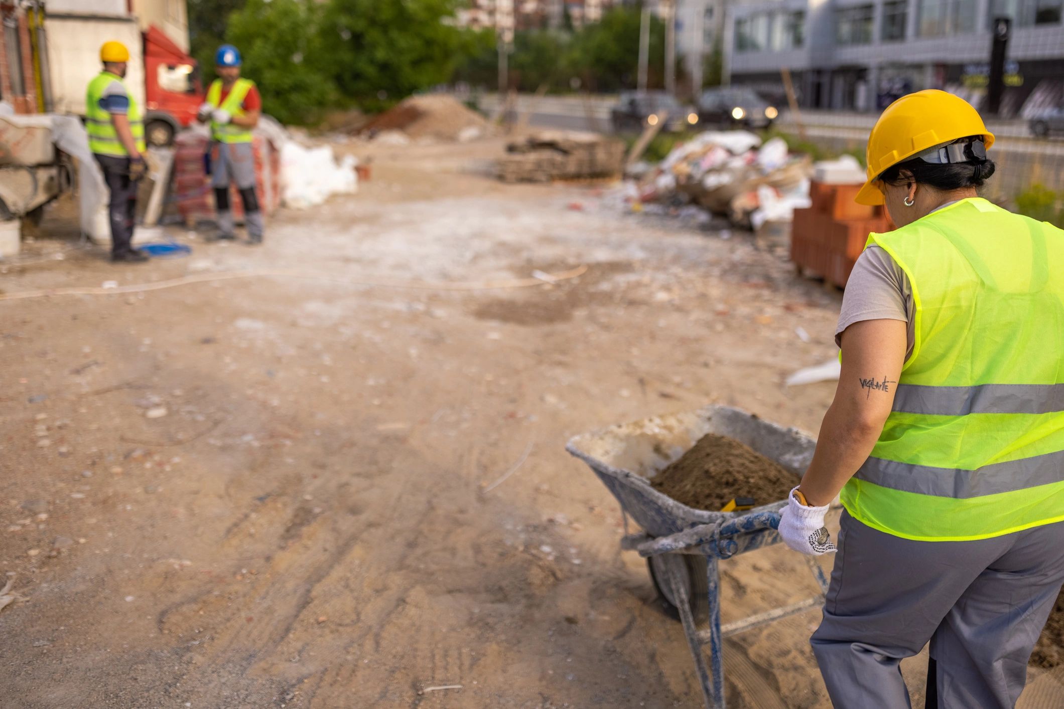 Construction worker moving materials at a job site