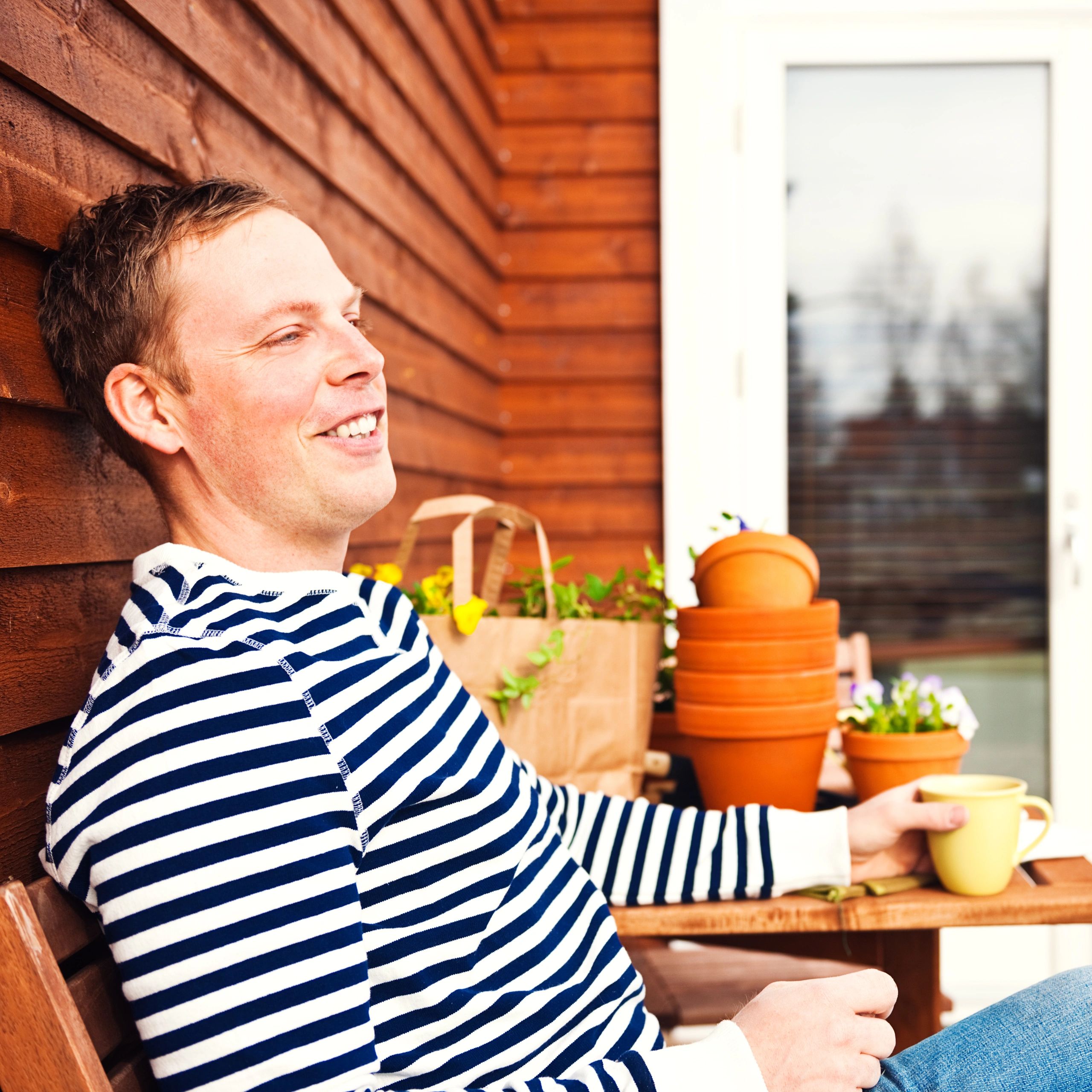 Homeowner taking a break outdoors near home exterior